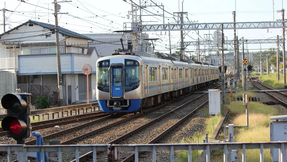 Nishitetsu Tenjin-Omuta Line 3000 series train departing from Nishitetsu Futsukaichi Station